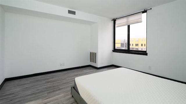 bedroom with light wood-type flooring