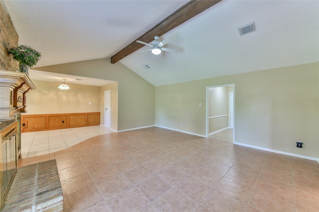 unfurnished living room with lofted ceiling with beams, light tile patterned flooring, and ceiling fan