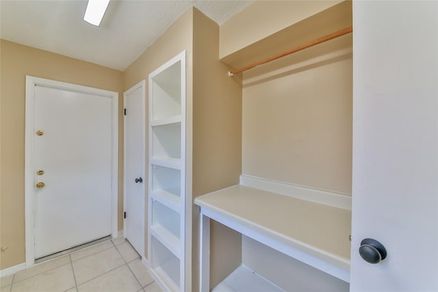 mudroom with light tile patterned floors