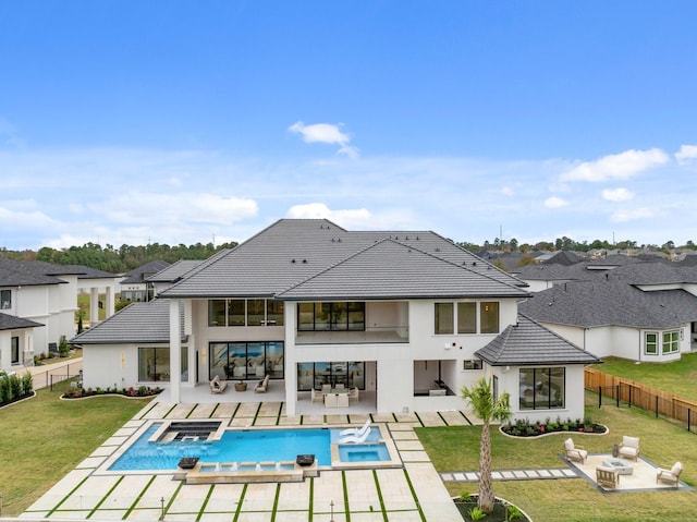 rear view of house featuring an outdoor living space with a fire pit, a yard, a patio, a residential view, and a fenced backyard