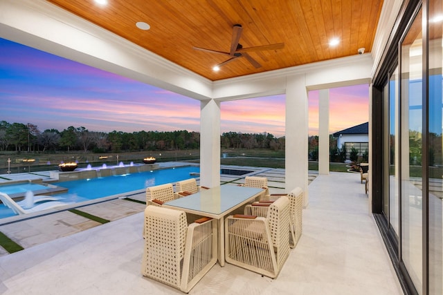 pool with a ceiling fan, outdoor dining area, and a patio area