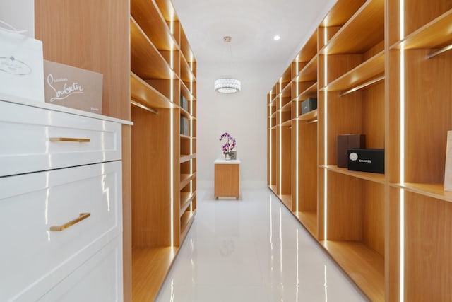 spacious closet featuring tile patterned flooring