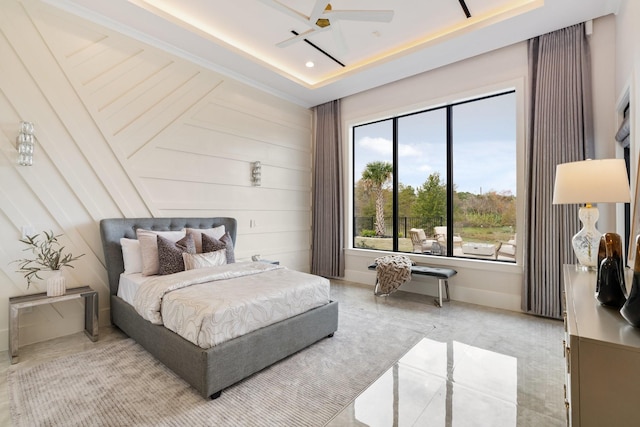 bedroom featuring a raised ceiling, a ceiling fan, and recessed lighting