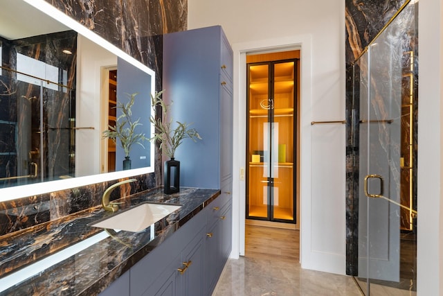 full bathroom featuring a shower stall and vanity