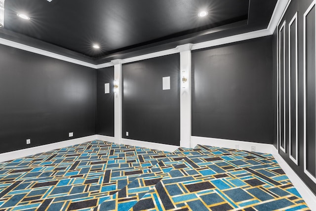 carpeted spare room featuring crown molding, baseboards, a raised ceiling, and recessed lighting