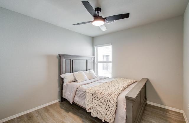 bedroom featuring hardwood / wood-style flooring and ceiling fan