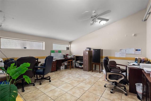 office space with light tile patterned flooring, ceiling fan, and vaulted ceiling