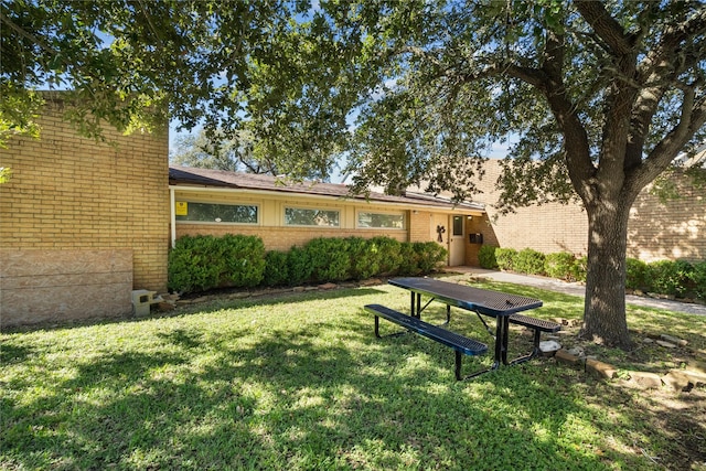 surrounding community featuring a yard