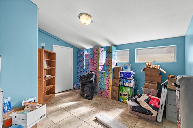 office area featuring light tile patterned flooring and lofted ceiling