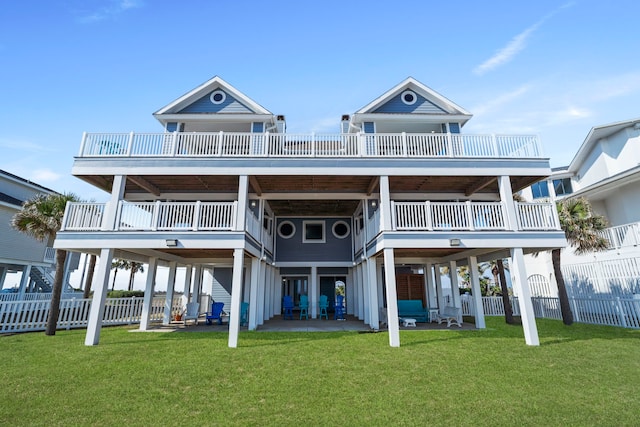 19307 Shores Dr, Galveston, TX 77554 - rear view of property featuring a yard and a patio area