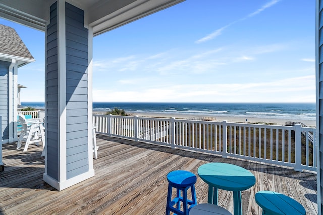 19307 Shores Dr, Galveston, TX 77554 - wooden deck featuring a water view and a view of the beach