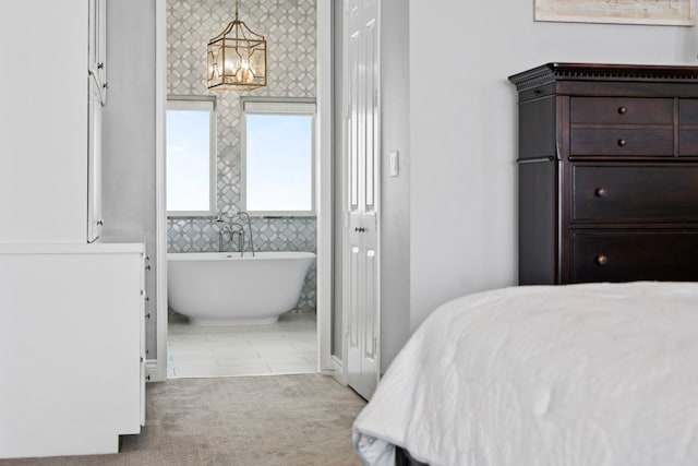 19307 Shores Dr, Galveston, TX 77554 - carpeted bedroom with a chandelier