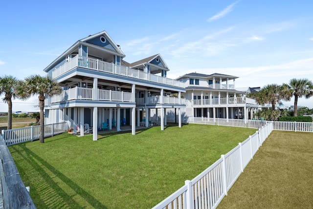 19307 Shores Dr, Galveston, TX 77554 - back of property with a yard and a balcony