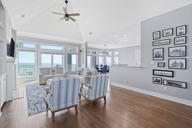19307 Shores Dr, Galveston, TX 77554 - living room featuring ceiling fan with notable chandelier, high vaulted ceiling, and dark hardwood / wood-style floors