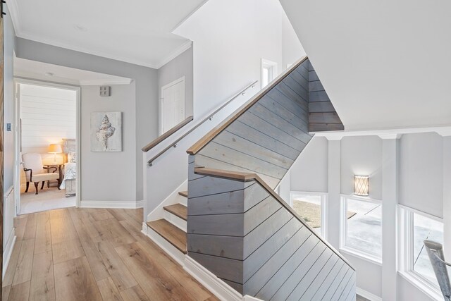 19307 Shores Dr, Galveston, TX 77554 - staircase with hardwood / wood-style flooring and ornamental molding