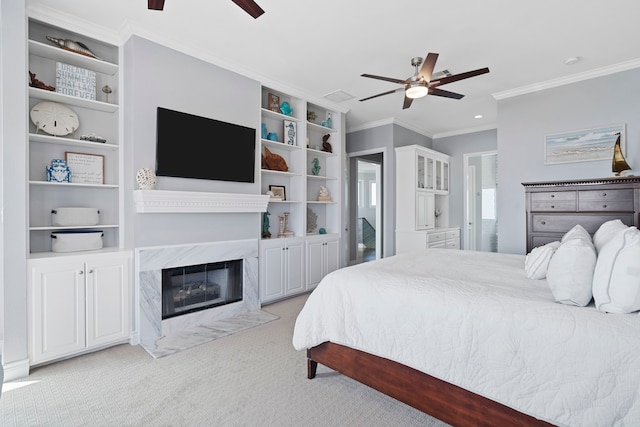 19307 Shores Dr, Galveston, TX 77554 - bedroom featuring light carpet, ornamental molding, a premium fireplace, and ceiling fan