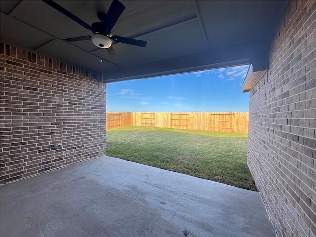 view of patio featuring ceiling fan