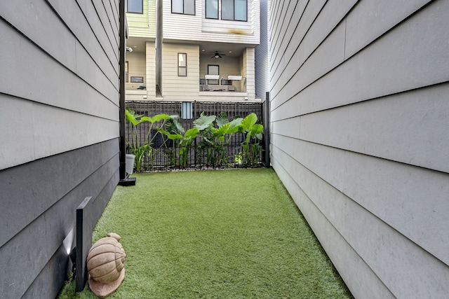 view of yard with ceiling fan