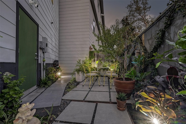 view of patio terrace at dusk