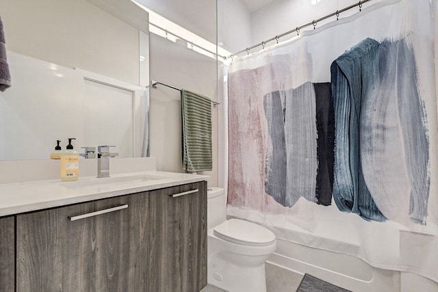 full bathroom with shower / bath combination with curtain, vanity, and toilet