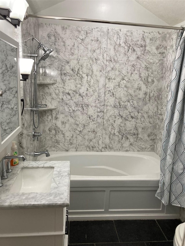 bathroom with tile patterned flooring, vaulted ceiling, shower / bathtub combination with curtain, and vanity