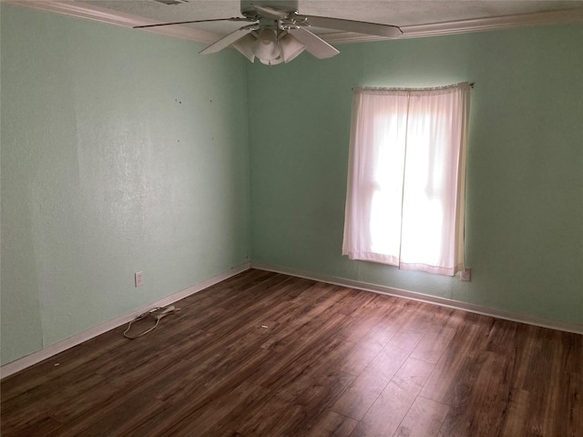 unfurnished room featuring crown molding, ceiling fan, and dark hardwood / wood-style flooring