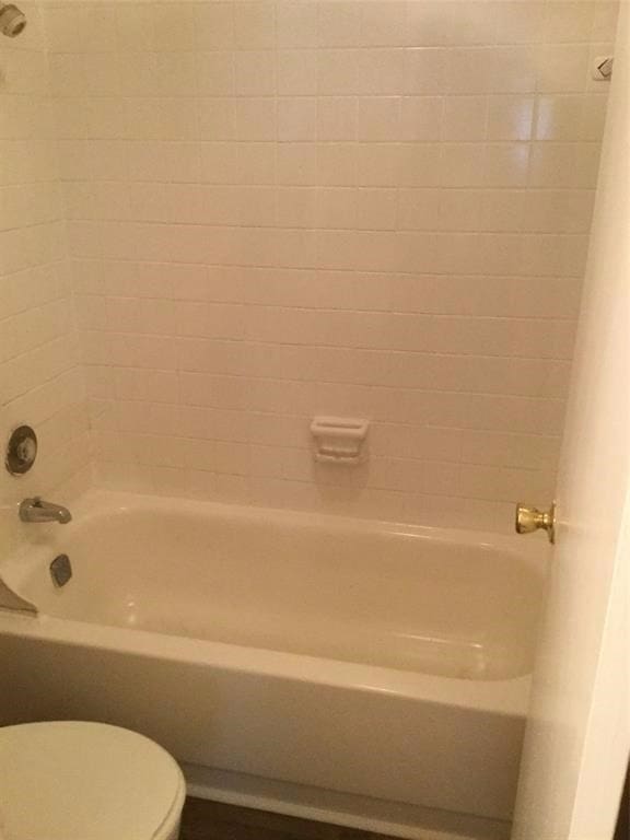 5625 Antoine Dr Unit 1309, Houston, TX 77091 - bathroom featuring tiled shower / bath and toilet