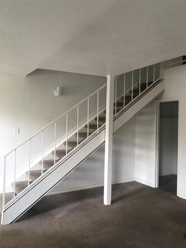5625 Antoine Dr Unit 1309, Houston, TX 77091 - staircase with carpet and a textured ceiling