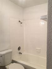 5625 Antoine Dr Unit 1309, Houston, TX 77091 - bathroom with tiled shower / bath combo and toilet