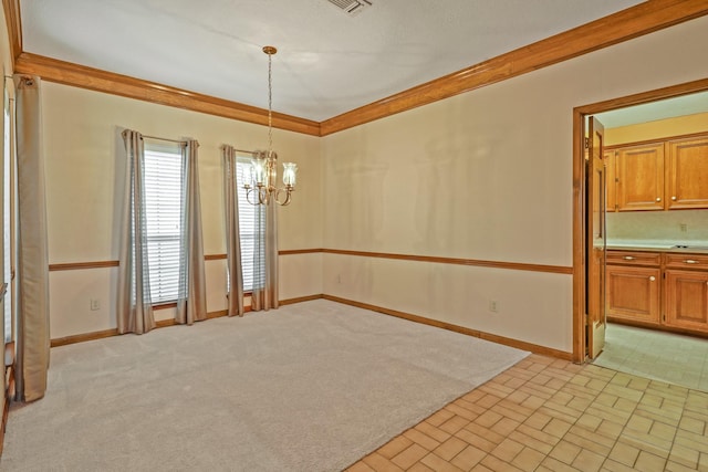 unfurnished dining area with ornamental molding, light carpet, and an inviting chandelier