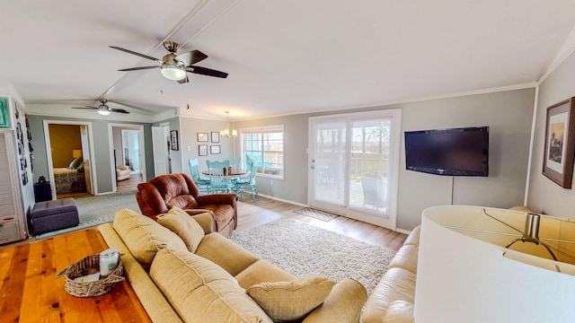 29331 County Rd 25, Damon, TX 77430 - living room with ceiling fan, ornamental molding, vaulted ceiling, and light wood-type flooring