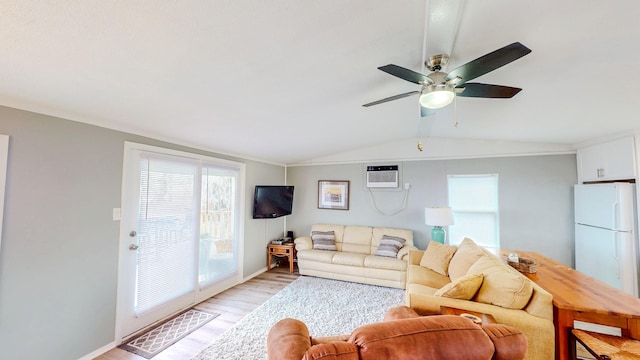 29331 County Rd 25, Damon, TX 77430 - living room with lofted ceiling, light hardwood / wood-style flooring, a wall unit AC, and ceiling fan