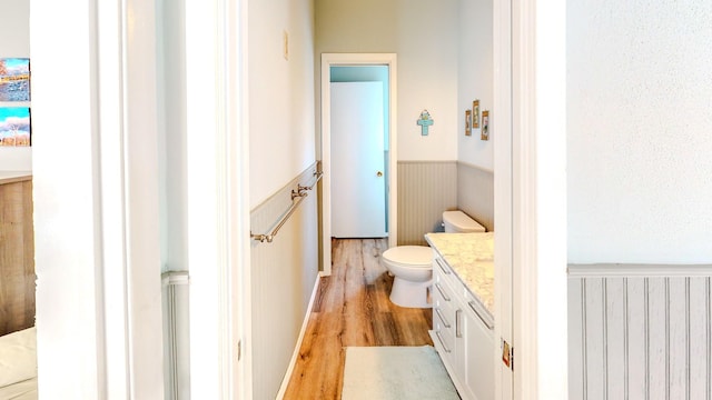 29331 County Rd 25, Damon, TX 77430 - bathroom featuring vanity, hardwood / wood-style floors, and toilet