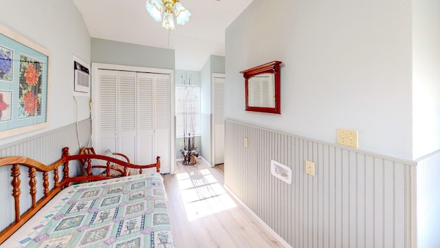 29331 County Rd 25, Damon, TX 77430 - bedroom featuring light hardwood / wood-style floors and a wall unit AC