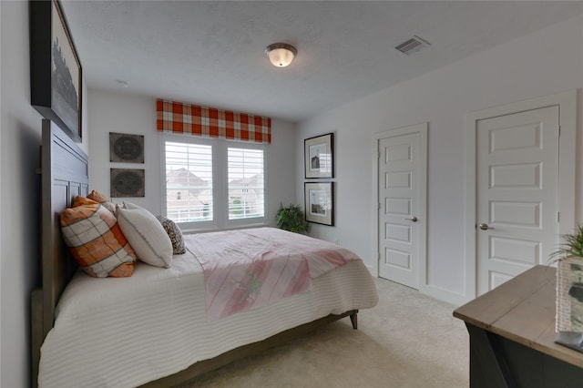 carpeted bedroom with a textured ceiling