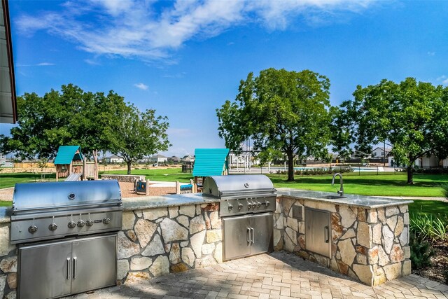 23506 Daisy Grubber Ln, Hockley, TX 77447 - view of patio / terrace featuring a sink and a playground