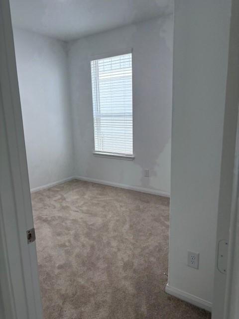 23506 Daisy Grubber Ln, Hockley, TX 77447 - carpeted empty room with baseboards