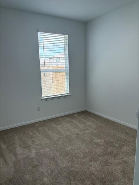 23506 Daisy Grubber Ln, Hockley, TX 77447 - empty room featuring carpet floors and baseboards