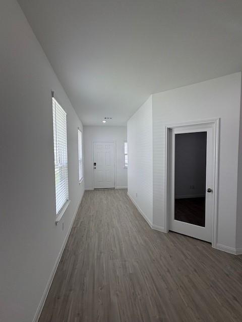 23506 Daisy Grubber Ln, Hockley, TX 77447 - hall featuring wood finished floors and baseboards