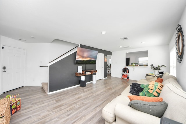 living room with light hardwood / wood-style floors