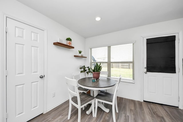 dining room with dark wood-type flooring