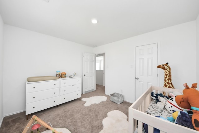 bedroom featuring dark colored carpet