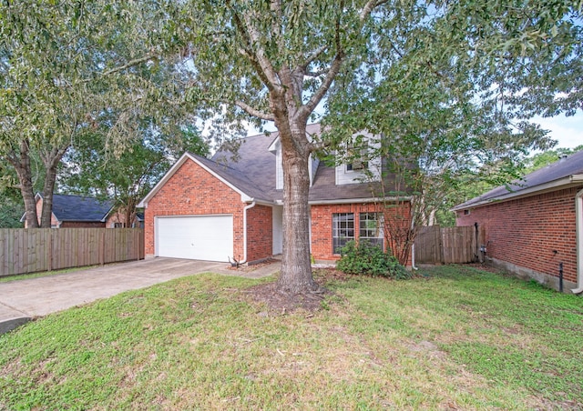 view of front facade with a garage and a front lawn