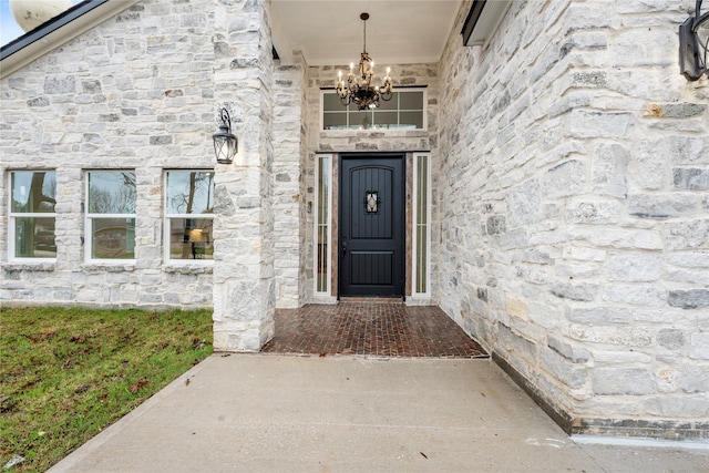 doorway to property featuring stone siding