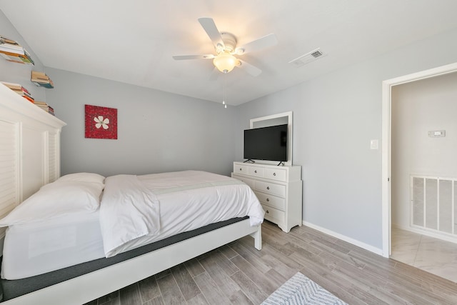 bedroom featuring ceiling fan and light hardwood / wood-style flooring