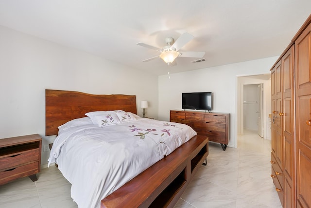 bedroom featuring ceiling fan and a closet