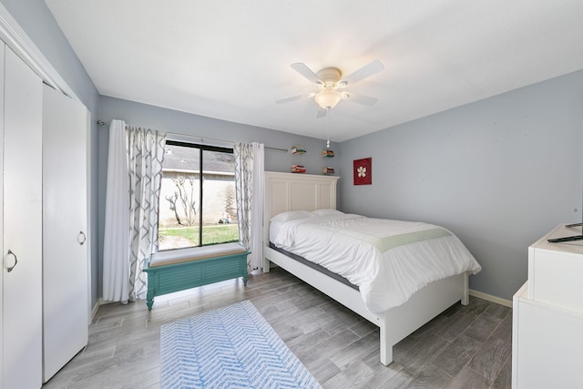 bedroom featuring ceiling fan and light hardwood / wood-style floors