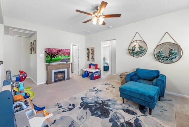 carpeted living room featuring ceiling fan