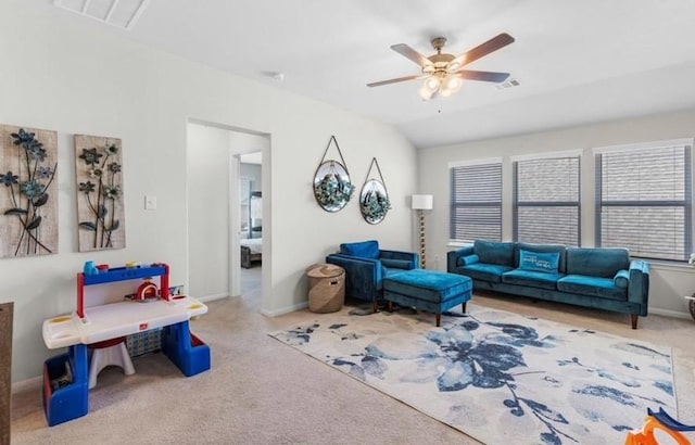 living room featuring ceiling fan and carpet floors