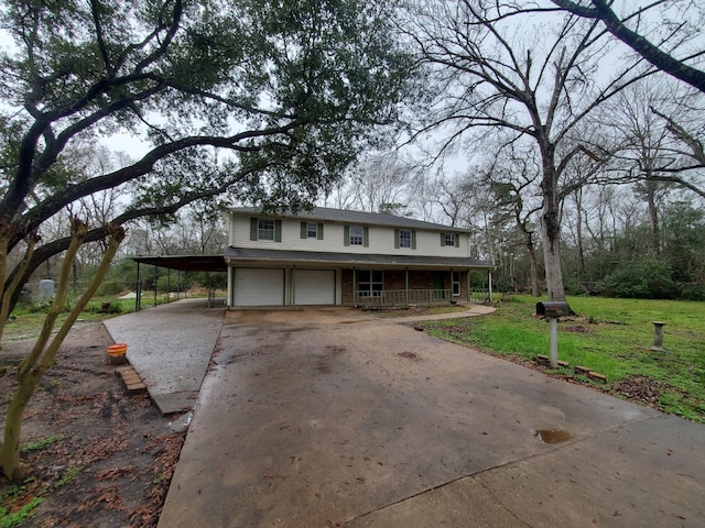 country-style home featuring a garage and a front lawn